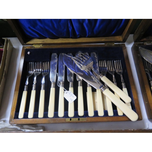 63 - A Cased Set of Six Silver Plated and Ivory Handled Fish Eaters with silver bands Sheffield 1916 and ... 