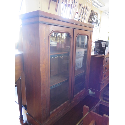 691 - A Victorian Walnut Glazed Bookcase