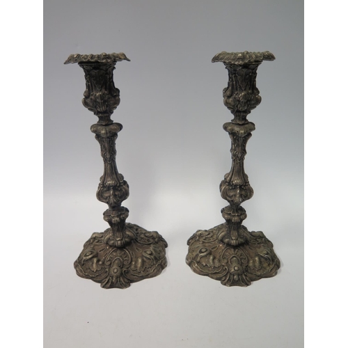 74b - A Pair of Victorian Silver Plated Candlesticks, the bases marked PROTECTED BY ACT OF PARLIAMENT, 27c... 