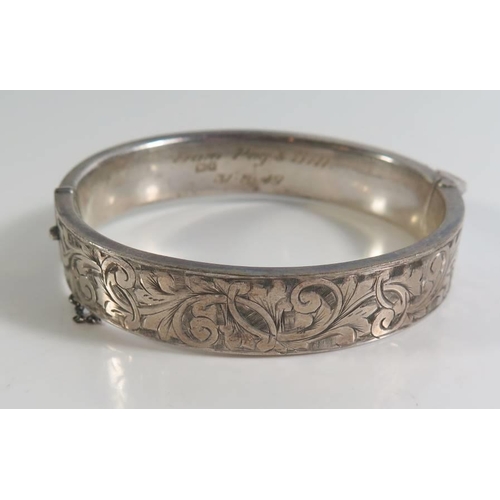 87 - A Chester Silver Hinged Bangle with chased foliate decoration