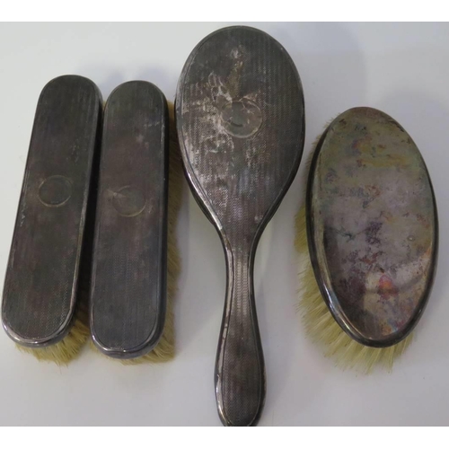 9 - A Three Part Silver Backed Brush Set and one other