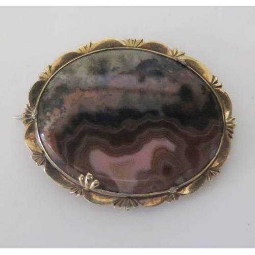 172 - A 19th Century Agate and Rhodochrosite Brooch in a precious yellow metal setting, 38x31mm
