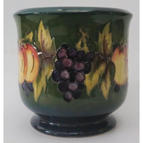 259 - A Moorcroft Green Ground Fruit Decorated Jardinière, 17.5cm high