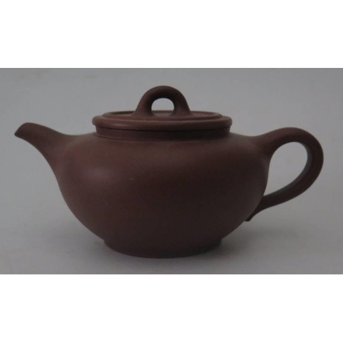 278 - A Chinese Yixing Terracotta Teapot, 17.5cm long