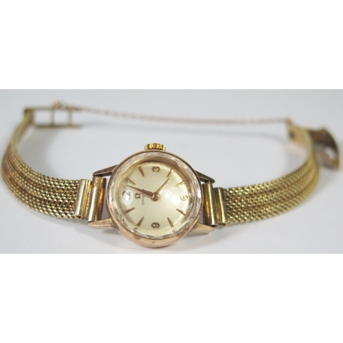 225 - An Omega Ladies Manual Wind Wristwatch with 14ct gold strap, running, 24.8g gross