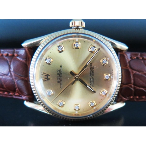 226 - A Gent's Rolex Wristwatch with 14K 33mm gold case and set with diamonds to the hours, running