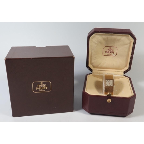 227 - A Patek Philippe Ladies 18ctGold Wristwatch with integral bracelet, 62.2g, inner and outer box, wind... 