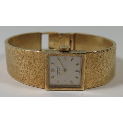 227 - A Patek Philippe Ladies 18ctGold Wristwatch with integral bracelet, 62.2g, inner and outer box, wind... 