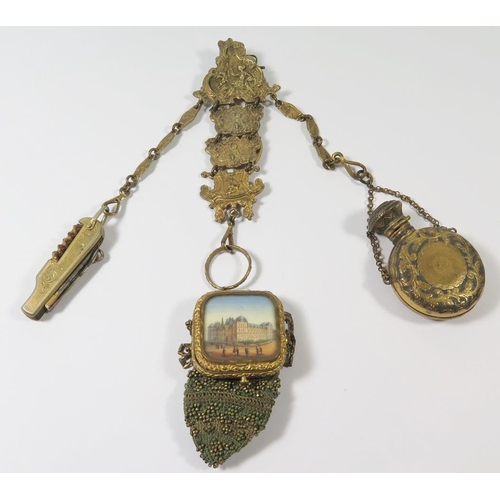 253 - A Nineteenth Century Austro Hungarian Gilt Metal Chatelaine comprising purse with hinged top reveali... 