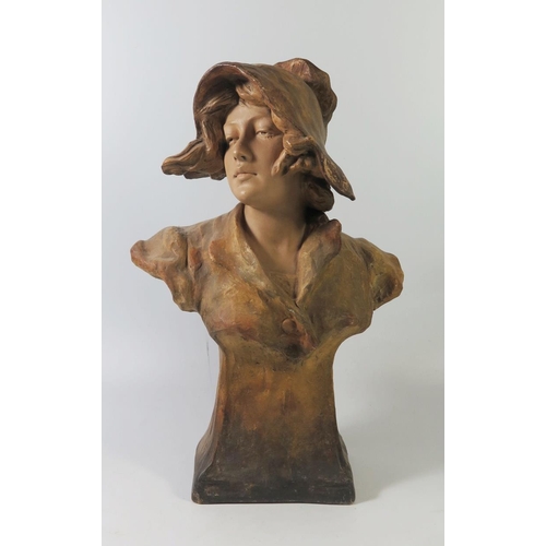 265 - A Friedrich Goldscheider Terracotta Bust of a young lady, 35cm tall