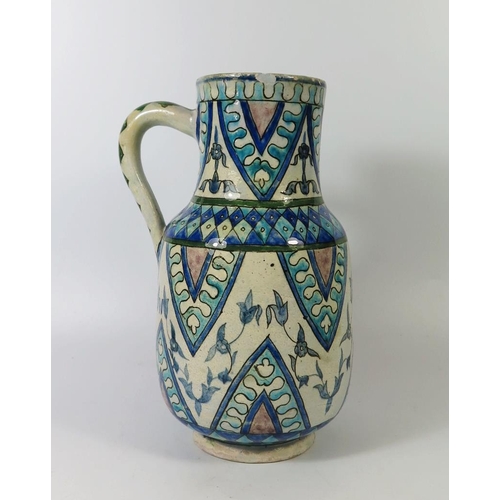 268 - An Iznik Pottery Jug, 26cm tall