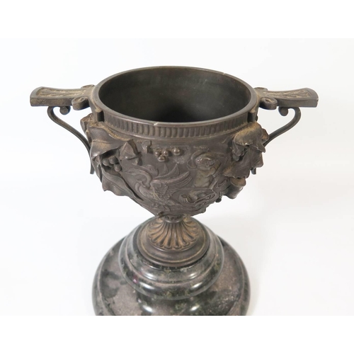 271 - A Nineteenth Century Cast Bronze Two Handled Urn on serpentine stand, 21cm tall