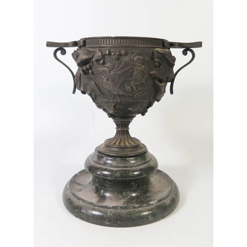 271 - A Nineteenth Century Cast Bronze Two Handled Urn on serpentine stand, 21cm tall