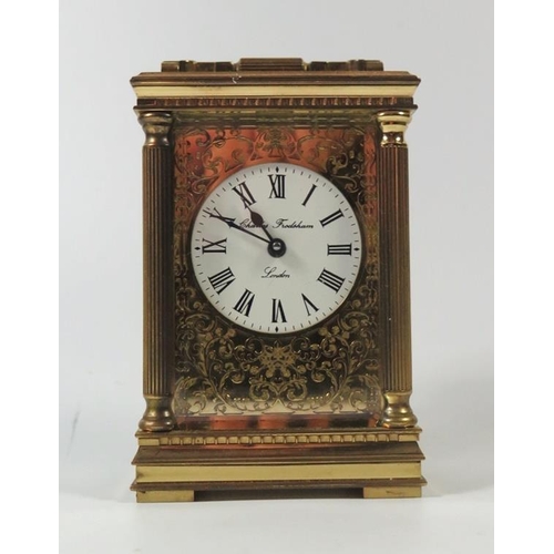 275 - A Charles Frodsham Modern Brass Carriage Clock, 14.5cm to top of handle, running and in retail box (... 