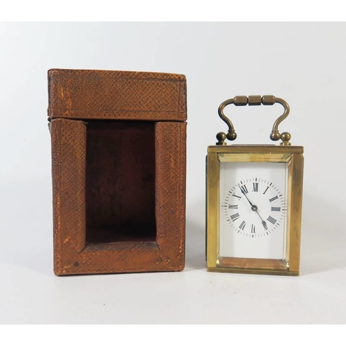 276 - A Small French Brass French Brass Carriage Clock in original leather carrying case, 8.5cm to top of ... 