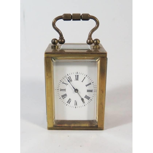 276 - A Small French Brass French Brass Carriage Clock in original leather carrying case, 8.5cm to top of ... 