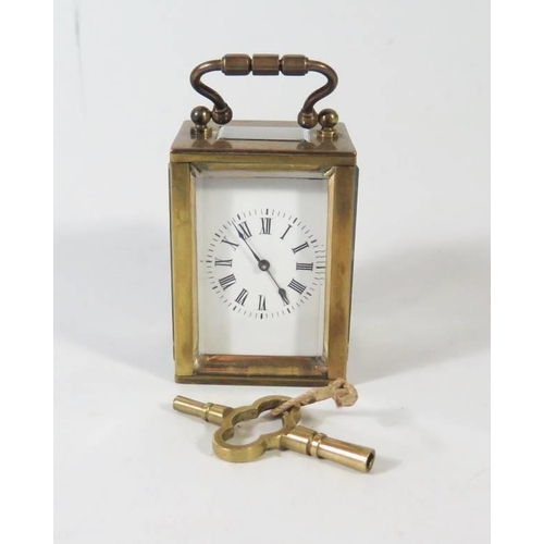 276 - A Small French Brass French Brass Carriage Clock in original leather carrying case, 8.5cm to top of ... 