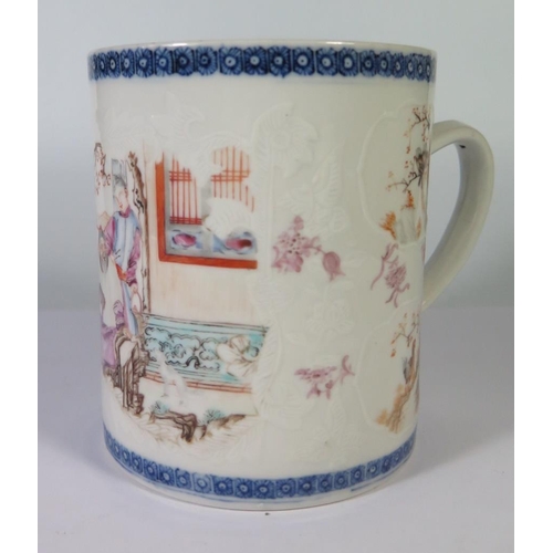 279 - A Nineteenth Century Chinese Export Mug decorated with figures and reserves of birds, 12.5cm high