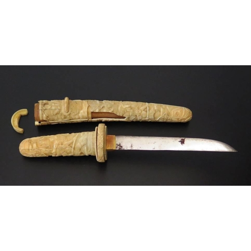 285 - A Nineteenth Century Japanese Tanto in ivory case, blade 16cm