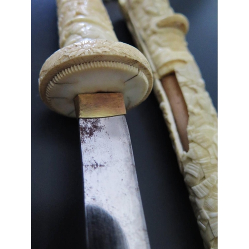 285 - A Nineteenth Century Japanese Tanto in ivory case, blade 16cm