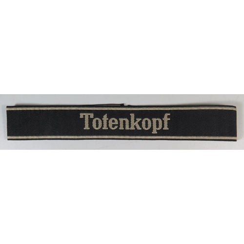 322 - A Replica German Totenkopf SS Panzer Division Cuff Title complete with SS issue label to the back