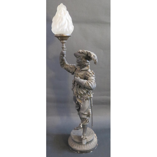 7 - A Large Spelter Figural Table Lamp in the form of a cavalier holding a flaming torch with glass shad... 