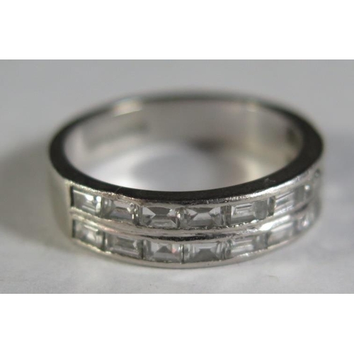 110 - A Platinum and Baguette Cut Diamond Half Eternity Ring, size J, 5.2g, some stones damaged