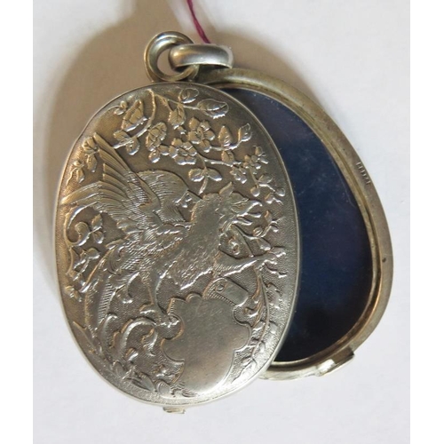 33 - A French Silver Swivel Locket Pendant decorated with griffin and lions head with a stylised foliate ... 