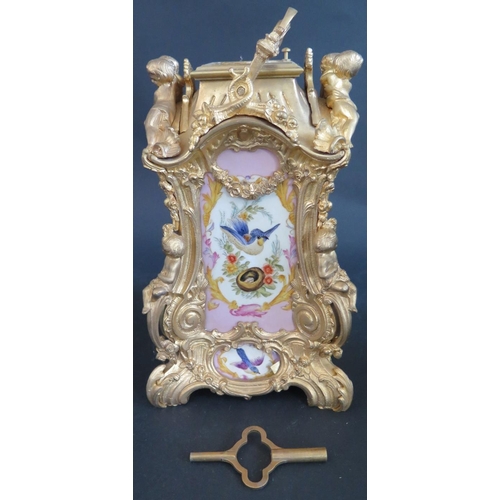 331 - An Ornate Repeating Carriage Clock with porcelain dial and panels, 23cm high, running