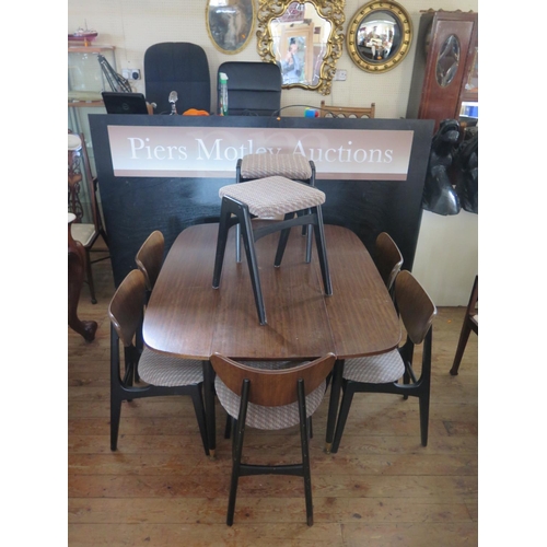 372 - A G.V. Wilkins for G-Plan Teak and Black Dining Suite comprising lap table, six chairs, two stools a... 