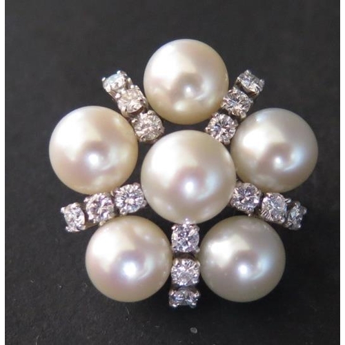 60 - A Pearl and Diamond Brooch in a precious white metal setting, c. 25mm diam., 10.3g