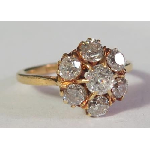 75 - An 18ct Yellow Gold Diamond Seven Stone Cluster Ring, size K, 3.4g, EDW.8ct