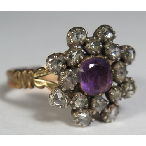 81 - A Georgian Amethyst and Rose Cut Diamond Cluster Ring in an unmarked high carat gold setting (20mm d... 