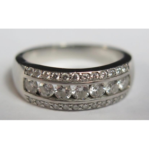 89 - A .950 Platinum and Diamond Half Eternity Ring set with seven 2.5mm stones with 24 .1mm stones to th... 