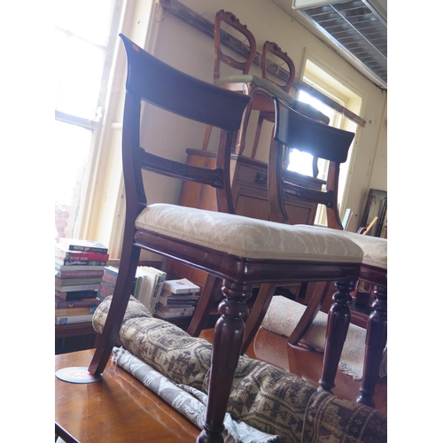 627 - A Regency Mahogany Tilt Top Pedestal Breakfast Table with four Victorian chairs