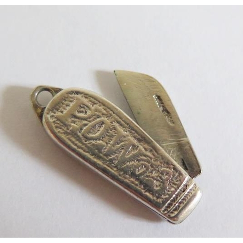 111 - A WWI P.O.W. Trench Art Silver Penknife Charm, made from a Victorian silver coin, 35mm extended