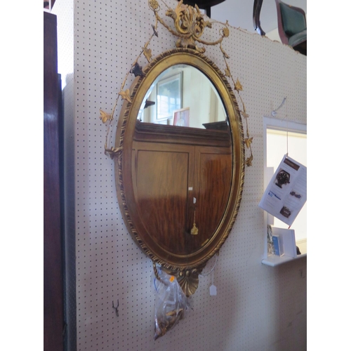 428 - An Oval Gilt Gesso Wall Mirror