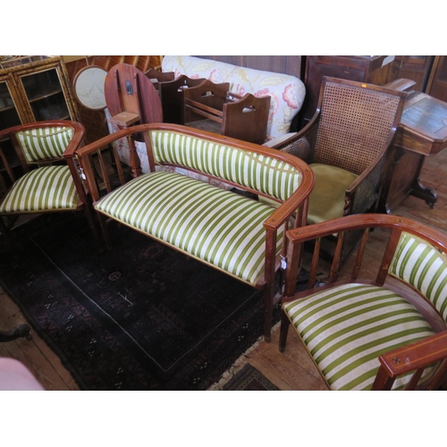 476 - A Viennese Secessionist Mahogany and Inlaid Sofa with matching armchairs, table and side chairs