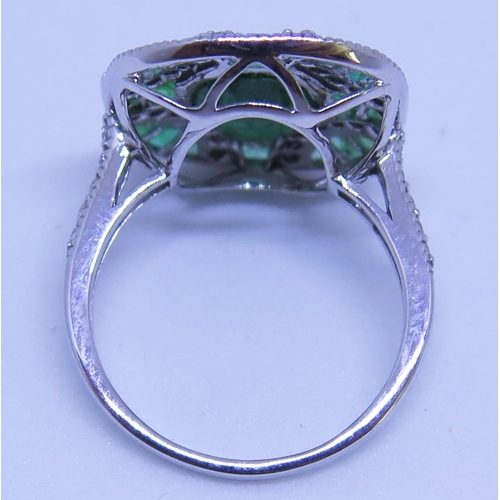 58 - A 14ct White Gold, Emerald and Diamond Ring (central emerald 1.61ct), size I.5, 3.5g