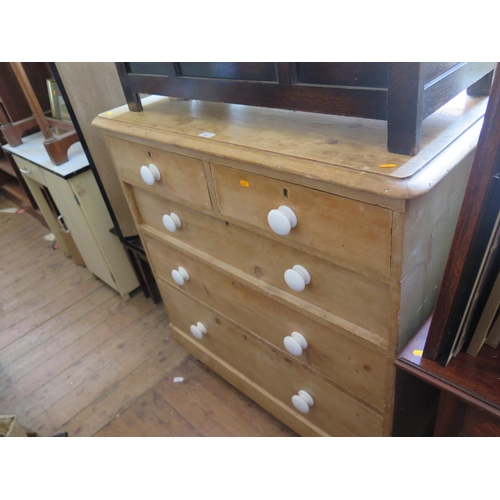 601 - An Antique Waxed Pine Chest of Drawers with porcelain handles