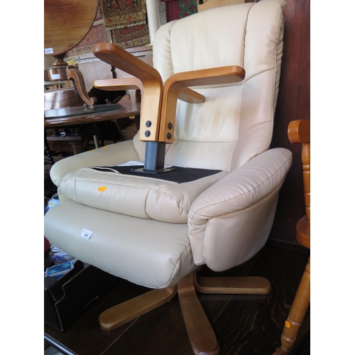 620 - A Cream Leatherette Ekornes Style Chair with stool