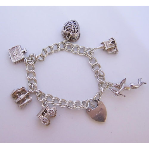 65 - A Silver Charm Bracelet, 33.7g