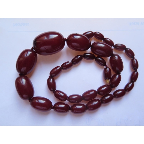 84c - A Faux Amber Bead Necklace, largest bead 27x19mm, 35.6g