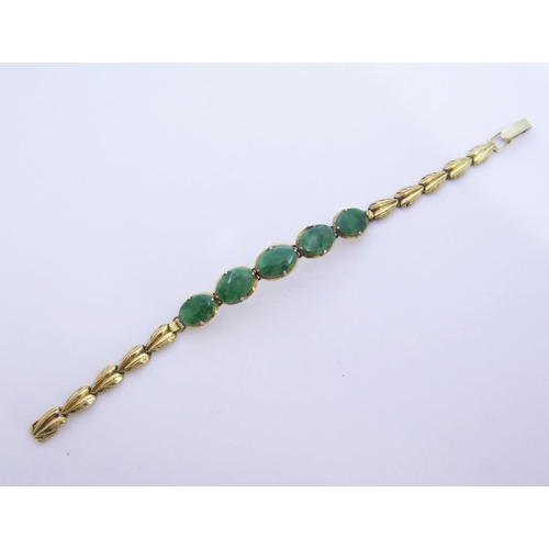 93 - A Jadeite Bracelet in yellow metal mount WITHDRAWN