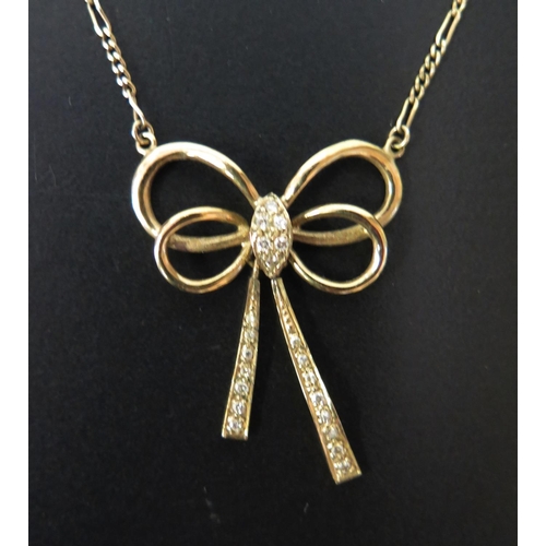 635 - A 9ct Gold and Diamond Ribbon Necklace on integral chain, 4.6g