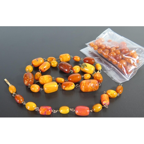 644 - An Amber Bead Necklace, bracelet and loose beads, 67g