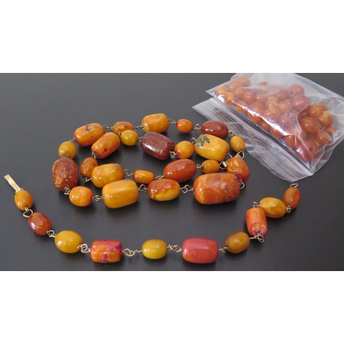 644 - An Amber Bead Necklace, bracelet and loose beads, 67g