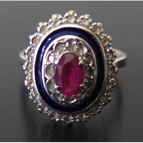 648 - An 18ct White Gold, Ruby and Diamond Ring with blue enamel frame, size N, 4.6g