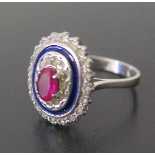 648 - An 18ct White Gold, Ruby and Diamond Ring with blue enamel frame, size N, 4.6g