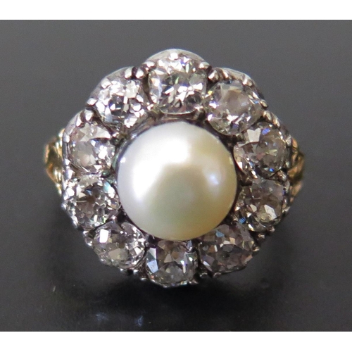 661 - An Old Cut Diamond and Pearl Cluster Ring in a high carat precious yellow metal setting, EDW 2.4ct, ... 